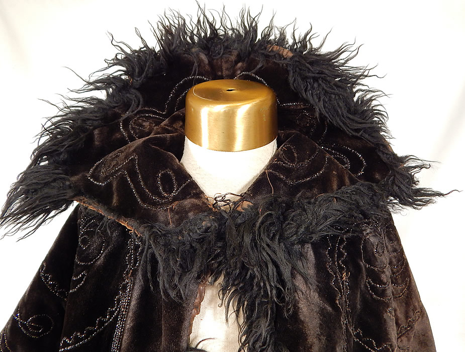 Victorian Black Velvet Jet Beaded Mohair Trim Winter Cloak Cape Mantle
 It is in good condition, with only some wear along the velvet nap and is missing 3 inches of mohair trim on the collar edging (see close-up). This is a wonderful piece of antique Victoriana winter mourning wearablee art!