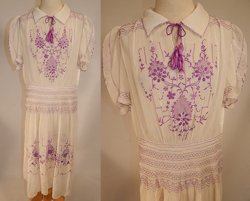 Vintage White Cotton Purple Embroidered Smocking Boho Peasant Drop Waist Dress
This vintage white cotton purple embroidered smocking boho peasant drop waist dress dates from the 1920s. It is made of a white sheer cotton batiste fabric, with drawn cut work and purple raised padded satin stitch, French knot hand embroidery work and smocking details with a floral vine leaf design. 