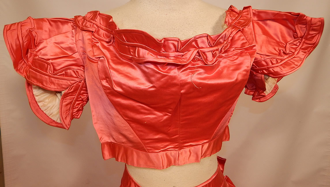 Victorian Magenta Pink Silk Ball Gown With Train Skirt 2 Bodices & Bow Belt
The second bodice has short cap sleeves, with scalloped ruffle trim, has an off the shoulder neckline, corseted back lacing closure and is fully lined. 