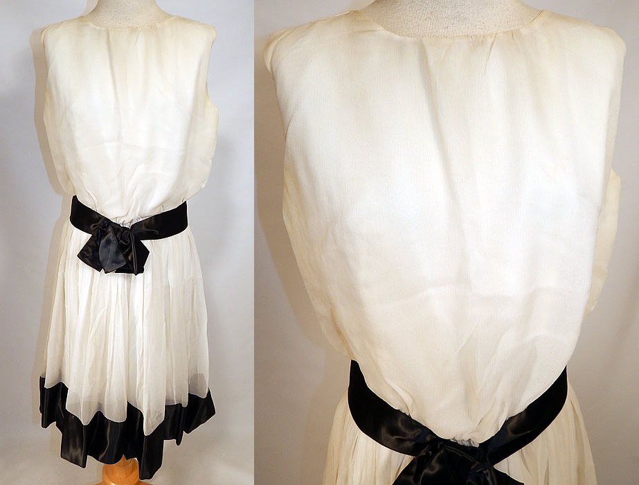 Vintage Mod Black & White Chiffon Belted A Line Sleeveless Cocktail Dress
This vintage mod black and white chiffon belted A line sleeveless cocktail dress dates from the 1960s. It is made of a sheer white chiffon fabric with black satin trim hemline and belted waist. 