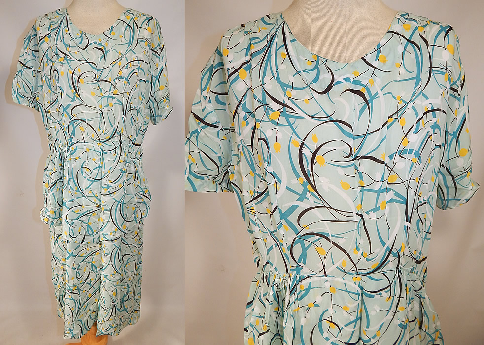 Vintage Teal Blue Floral Swirls Abstract Novelty Print Rayon Peplum Skirt Dress
This vintage teal blue floral swirls abstract novelty print rayon peplum skirt dress dates from the 1940s. It is made of a teal blue color rayon fabric with yellow, black and white floral, swirl abstract print pattern designs