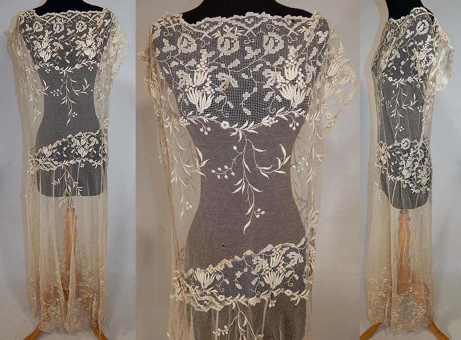 Vintage Cream Filet Lace Embroidered Tulle Net Drop Waist Boho Maxi Dress
This vintage cream filet lace embroidered tulle net drop waist boho maxi dress dates from the 1920s. It is made of an off white cream color sheer tulle net filet lace fabric with raised padded satin stitch embroidery work done in a floral vine leaf design.