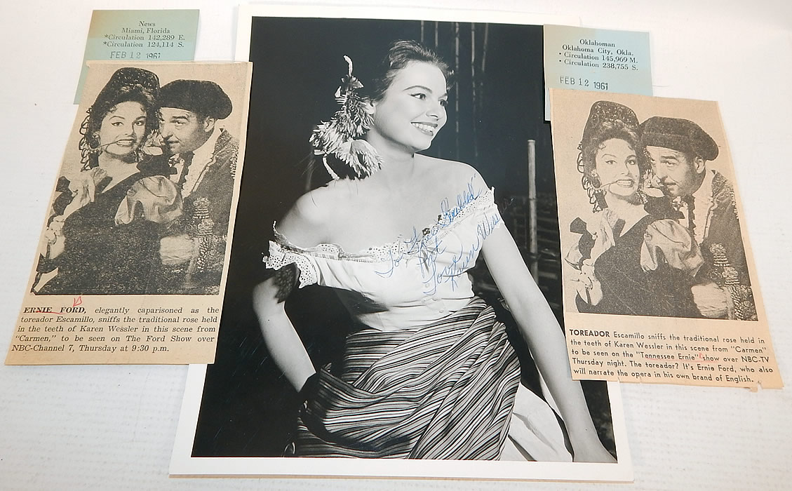 Vintage White Silk de Chine Silver Beaded One Shoulder Grecian Goddess Gown
This custom made evening gown is from the estate of Karen Wessler who performed on the Tennessee Ernie Ford Show as one of "The Top Twenty", Ernie's back-up group (see publicity photo stills below). It is in good condition, but has not been cleaned, with some faint makeup stains around the inside top lining and slight discoloration under the arms. This is truly a wonderful piece of custom made wearable art! 