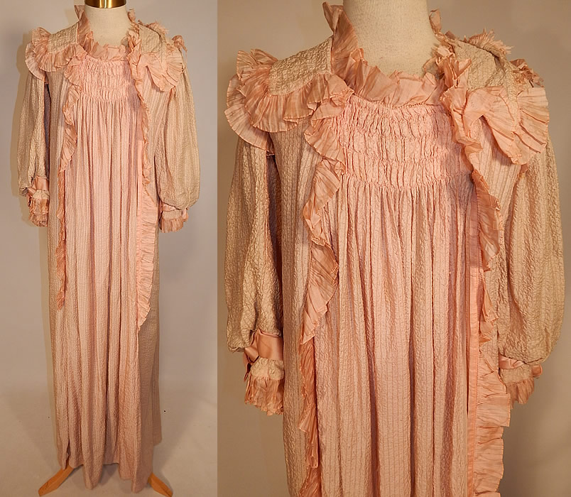 Victorian Pink Crinkle Crepe Silk Ruffle Morning Tea Gown Wrapper Robe Dress
This antique Victorian pink crinkle crepe silk ruffle morning tea gown wrapper robe dress dates from 1900. It is made of a pale pastel pink crinkle crepe silk fabric, with a striped ribbed texture and smocking ruched gathering on the front and back top. 