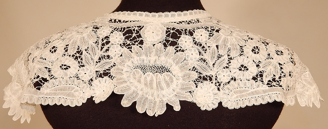 Victorian Antique Hand Made White Duchesse Bobbin Lace Shawl Collar
This lovely lace shawl collar dress trim has scalloped trim edging, an open front with no closure and is sheer, unlined.