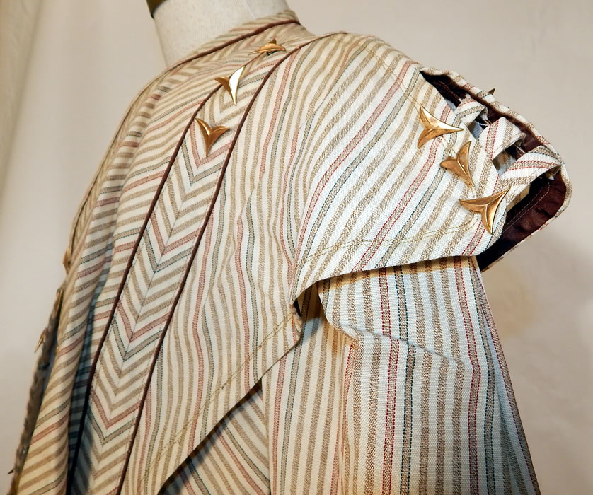 Victorian Brown & White Chevron Striped Wool Walking Suit Jacket Skirt
This stunning striped two piece walking suit includes a short bolero bodice jacket top, with an epaulette style shoulder piece strap, collar overlay, 3/4 length full puffy sleeves, scalloped eyelet lace cuffs, brown piping trim, hook closures down the front and remnants of the silk lining which has been removed. 