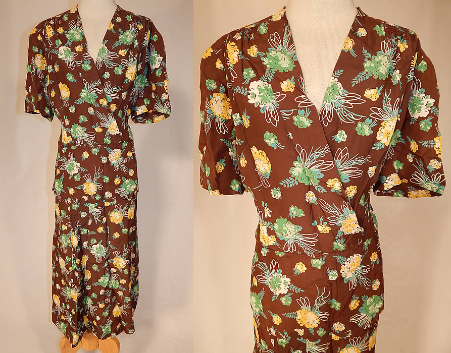 Vintage Brown Green Yellow Flower Bouquet Novelty Print Rayon Peplum Dress
This vintage brown, green, yellow flower bouquet novelty print rayon peplum dress dates from the 1940s. It is made of a brown rayon fabric with a green, yellow and white bouquet flower print design. This pretty novelty print dress has a fitted peplum skirted waist with scalloped hem, an open wrap front V neckline, slight shoulder padding, short sleeves, no opening closures and is unlined