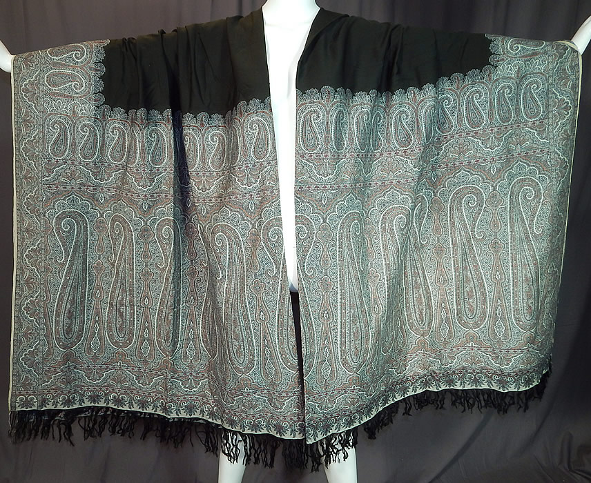 Victorian Antique Large Banquet Size Jacquard Loom Black & Blue Wool Paisley Shawl
This Victorian era antique large banquet size jacquard loom black and blue wool paisley shawl dates from the 1880s. It is made of jacquard hand loomed woven wool done in shades of blue, gold, black and white.