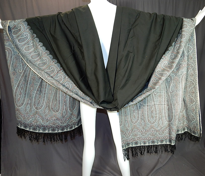 Victorian Antique Large Banquet Size Jacquard Loom Black & Blue Wool Paisley Shawl
This stunning shawl has wonderful workmanship and detail with a black fringed border on the two ends, white selvage along the side edgings and a large black wool center.