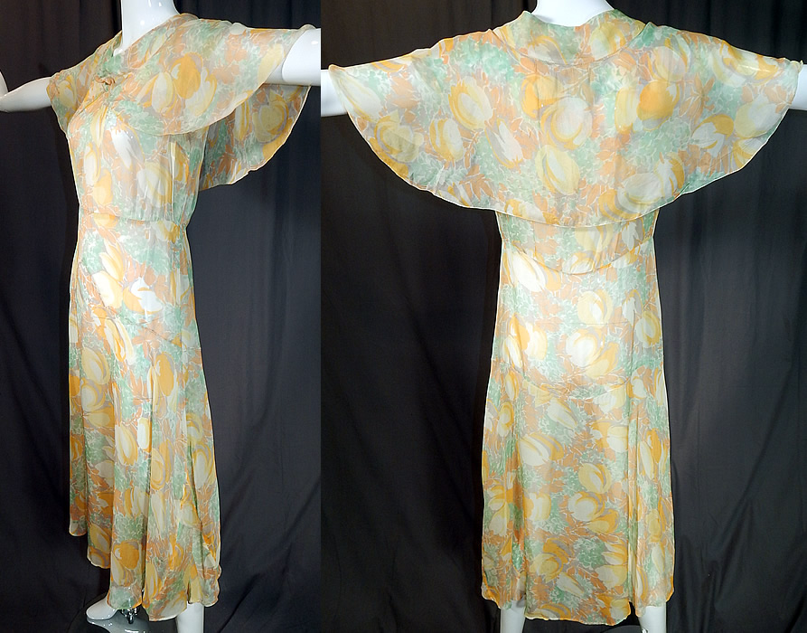 Vintage Yellow Tulip Flower Print Silk Shawl Collar Cape Bias Cut Dress
The dress measures 47 inches long, with 44 inch hips, a 30 inch waist and 36 inch bust. 