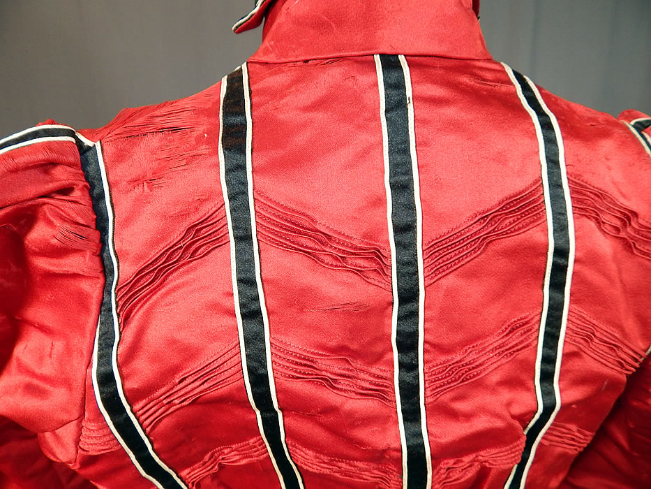 Victorian Red Silk Black & White Striped Pleated Bodice Blouse
The bodice measures 16 inches long, with a 22 inch waist, 30 inch bust, 22 inch long sleeves and 12 inch neck. It is in fair as-is condition, with several small frayed splits in the silk scattered along the shoulders and sleeves (see close-up). This is truly a wonderful piece of Victoriana textile art which would be great for display or design!