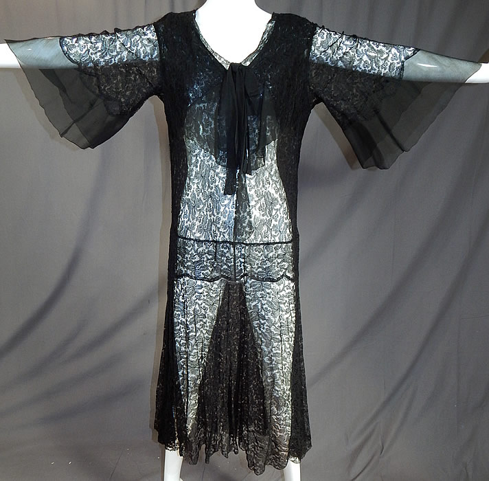 Vintage Sheer Black Silk Chiffon & Lace Drop Waist Kimono Sleeve Flapper Dress
It is made of a sheer fine black silk lace fabric with a floral vine leaf pattern and black silk chiffon trim edging on the front top and sleeve cuffs. 