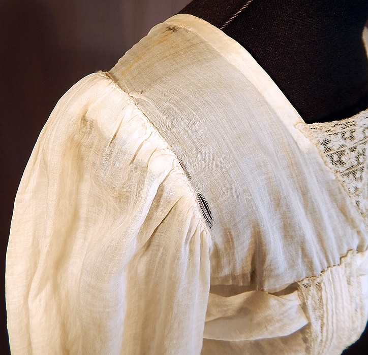 Victorian Cream Cotton Batiste Embroidery Applique Lace Lawn Dress Tea Gown
It is in fair as-is condition, needing some minor restoration, has not been cleaned with slight faint yellowing staining in areas, a mended repair on the back top and some small frayed holes along the shoulders (see close-up). Great for design! This is truly a wonderful piece of wearable antique lace art which could be worn as a wedding or graduation dress!