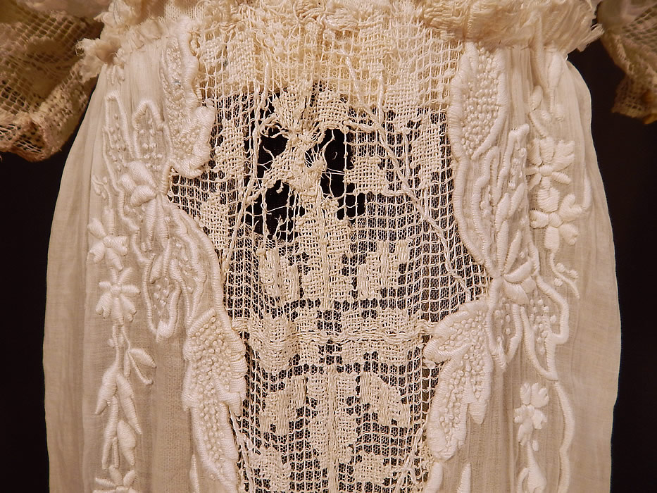 Edwardian Titanic Embroidered French Knot Batiste Filet Lace Lawn Dress Tea Gown
The dress measures 59 inches long, with a 24 inch waist and 36 inch bust. It is in fair as-is condition, needing some restoration, with several small frayed holes scattered in areas and sleeve damage (see close-ups). 