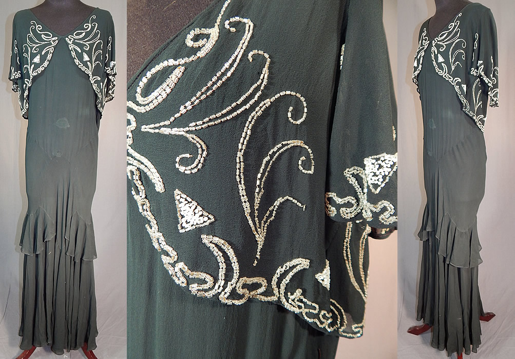 Vintage Black Silk Chiffon Butterfly Beaded Bias Cut Evening Gown Dress
This vintage Art Deco black silk chiffon butterfly beaded bias cut evening gown dress dates from the 1930s. It is made of a black sheer silk chiffon fabric with white and silver beading done in an abstract butterfly design on the front top, swirling, triangle designs along the back and sleeves.