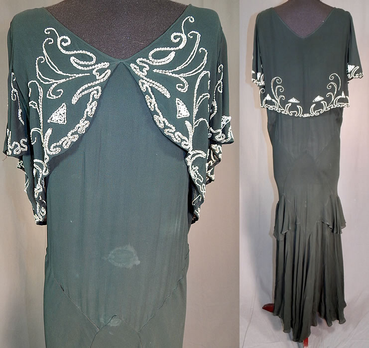 Vintage Black Silk Chiffon Butterfly Beaded Bias Cut Evening Gown Dress
It is in fair as-is condition, has not been cleaned, with some white staining discoloration on the front skirt, bottom hemline, under the arms and has a few frayed small holes on the shoulder (see close-ups).