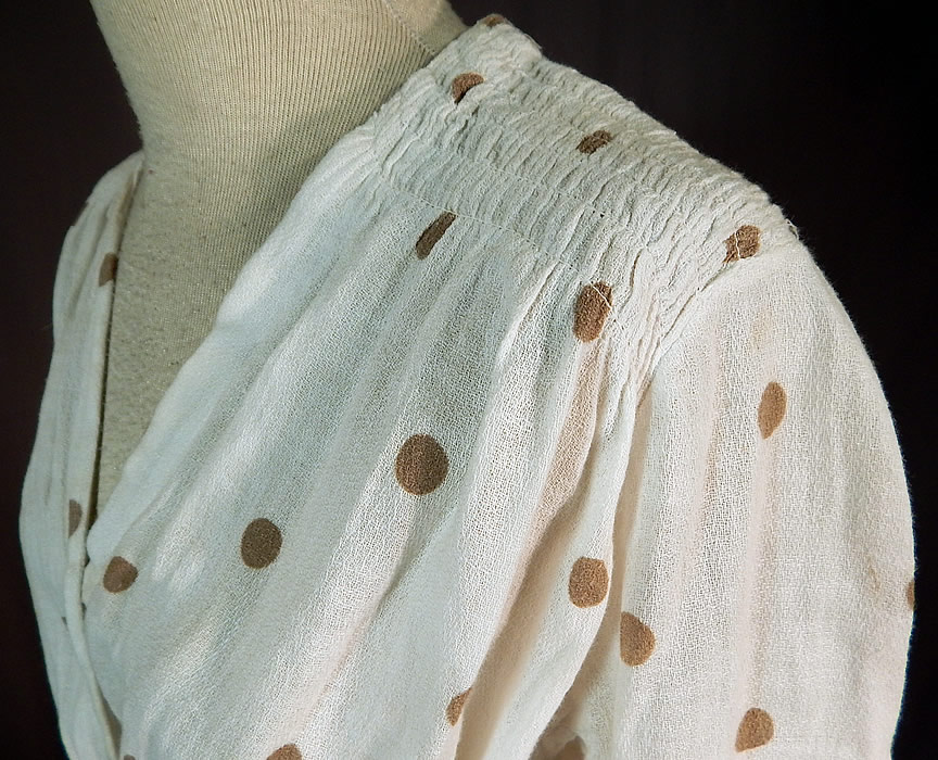 Edwardian White Cotton Muslin Brown Polka Dot Print Shoulder Smocking Dress
It is in good condition, but has not been cleaned, with a few faint small yellowing discoloration staining in areas which is barely noticeable. This is truly a wonderful piece of wearable art!