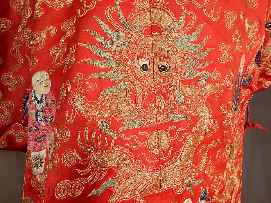 Antique Chinese Dragon Phoenix Gold Couching Embroidery Red Silk Opera Robe
This magnificent theatrical opera costume is created in the style of Manchu style dragon court robe, with a loose fitting, long mid knee length, side vents, with colorful metallic couching waves of water along the bottom skirt hem, long wide full sleeves, silk ties for closure along the side and is fully lined. 