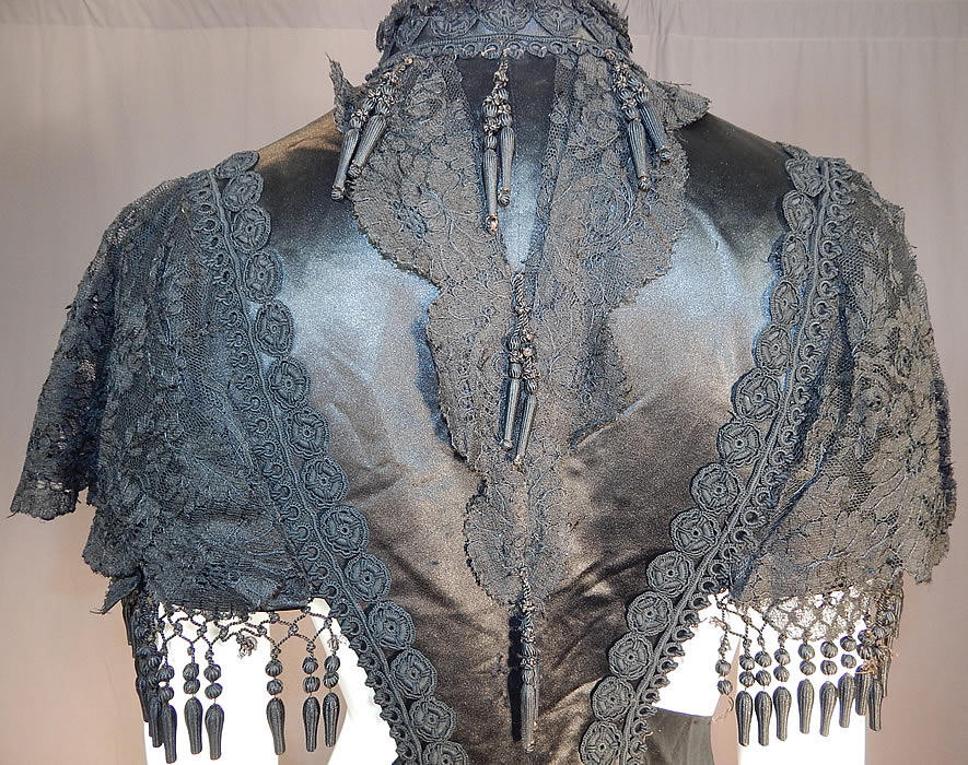 Victorian Black Silk Chantilly Lace Passementerie Mourning Mantle Pelerine Cape
It is in good as-is condition, with only a few missing silk ball fringe trim and some fraying on the inside silk lining. This is truly an amazing piece of antique Victoriana mourning wearable art!