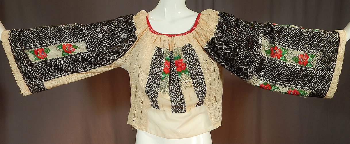 Vintage Romanian Hand Embroidery Black & White Lace Beaded Boho Peasant Blouse
The top measures 22 inches long, with a 38 inch bust, 38 inch waist and 22 inch long sleeves. 