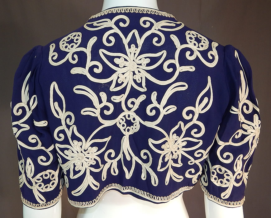 Vintage Irene Kay Navy Blue Silk Crepe Cream Soutache Shrug Bolero Jacket
There is an "Irene Kay" designer label sewn inside.