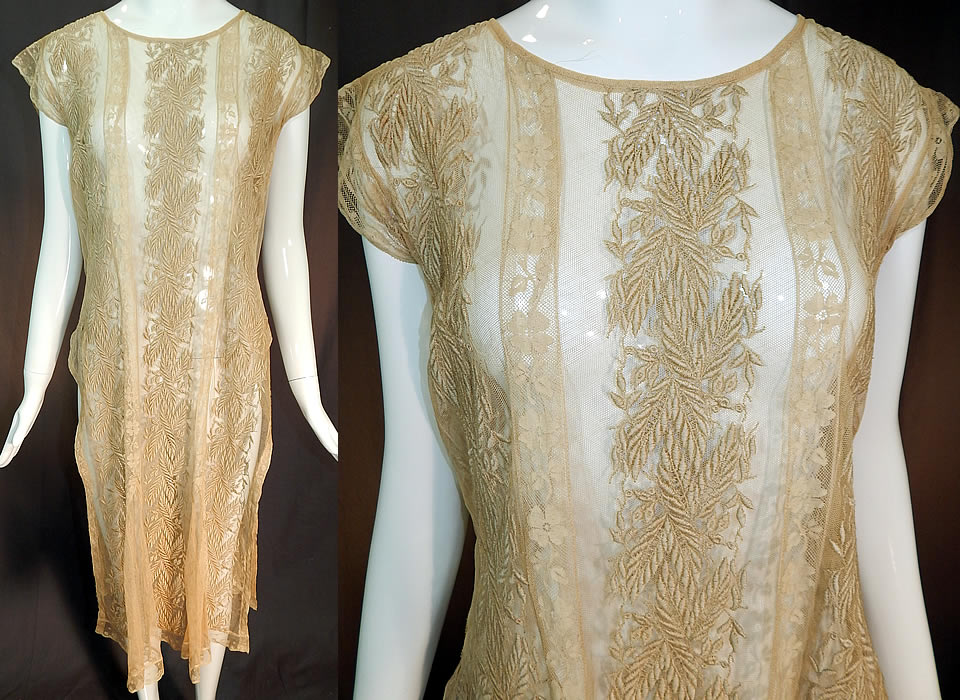 Vintage Embroidered Ecru Net Lace Tabard High Slit Chemise Shift Dress
This vintage embroidered ecru net filet lace tabard high slit chemise shift dress dates from the 1920s. It is made of an ecru cream color sheer tulle net fabric, with raised padded satin stitch embroidery work done in a wheat stalk leaf design and Valenciennes lace trim inserts with floral pattern.