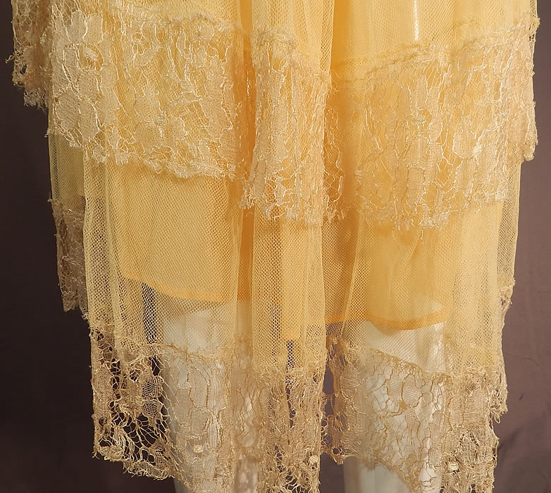 Vintage Art Deco Yellow Silk Cobweb Lace Handkerchief Skirt Flapper Dress
This fabulous flapper dress has a fitted sleeveless top with front gathering, a drop waist, layered tiered uneven handkerchief lace hemline full skirt slightly longer in the back, side snap closures and is sheer, unlined. 