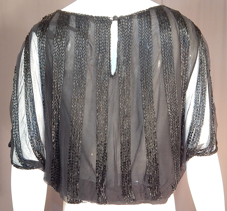 Vintage Art Deco Sheer Black Silk Beaded Batwing Sleeve Blouse Shirt Top
The blouse measures 17 inches long, with a 44 inch bust and 34 inch waist. It is in excellent condition. This is truly a wonderful piece of Art Deco beaded wearable art!