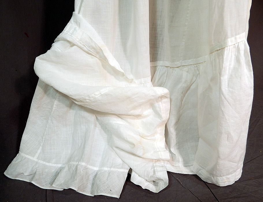 Victorian White Cotton Batiste Ruffle Back Train Wedding Skirt Petticoat
The skirt measures 38 inches long in the front, 48 inches long in the back, with a 21 inch waist. It is in good condition, with only a faint discoloration stain on the bottom front. This is truly a wonderful piece of antique Victoriana bridal wearable art! 