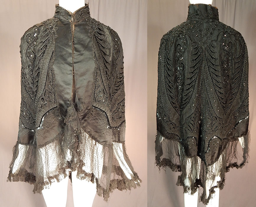 Victorian Hubert & Riqueur Paris Label Black Silk Lace Jet Beaded Mantle Cloak Cape
This antique Victorian era Hubert & Riqueur Paris label black silk, lace, jet mantle cloak cape dates from 1890.