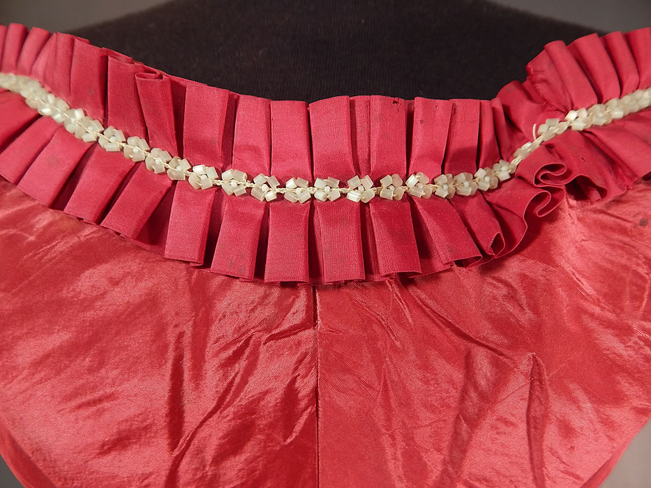 Victorian Civil War Era Red Silk White Beaded Ball Gown Bodice Corset Top
It is made of a crimson red color silk moire taffeta fabric, with a silk box pleat ruffle trim and white beaded neckline. 