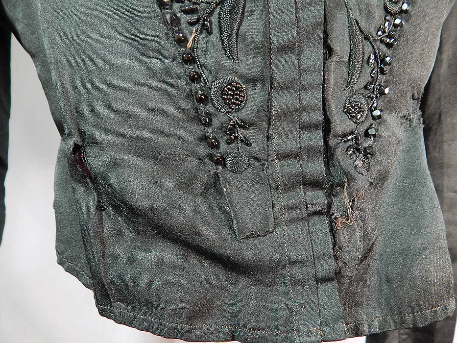 Victorian Black Silk Embroidered Jet Beaded Bodice Coat Jacket
It is in fair as-is condition, with some frayed, mended repairs on the bottom front and some fraying along one shoulder (see close-ups). 