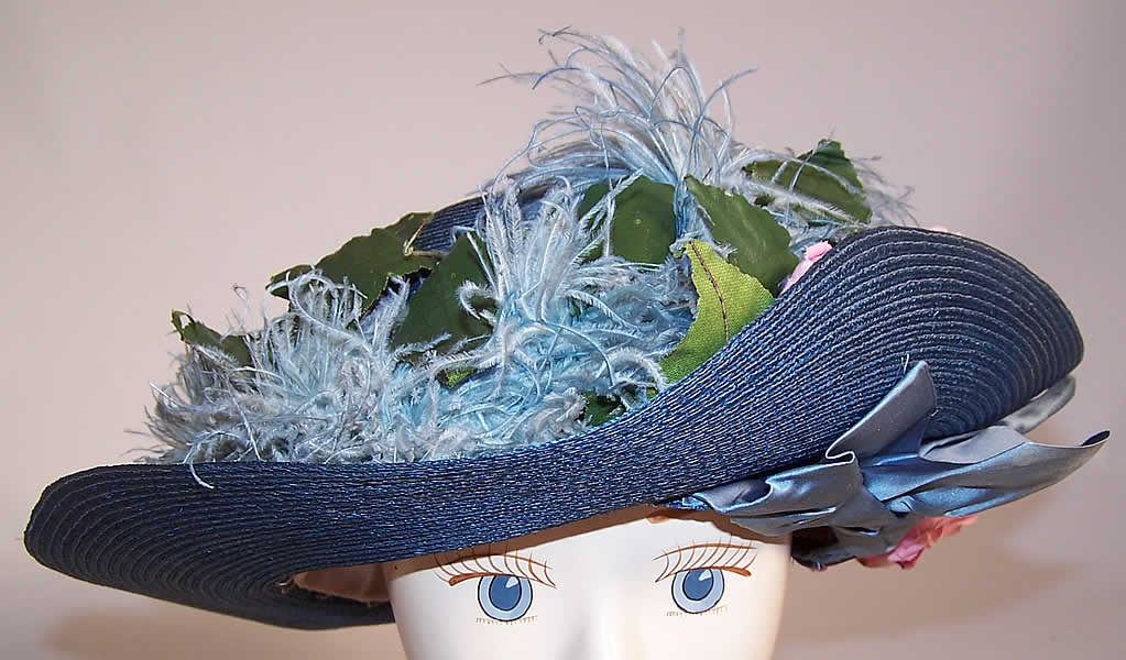 Belle Epoque Blue Straw Feather Ribbon Rosette Wide Brim Hat Front view.