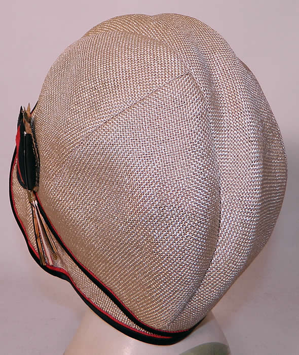 Vintage Flo Lill Art Deco Red, Black & White Straw Feather Flapper Cloche HatThe hat measures 22 inches inside circumference. It is in good condition, with only some fraying splits on the inside silk lining and some wear feather loss on the side trim. 