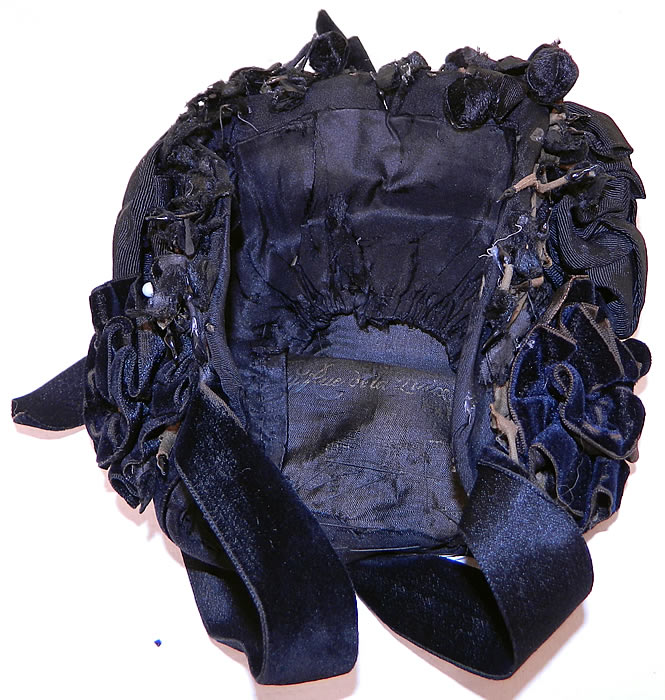 Victorian Black Silk Jet Beaded Trim Paris Label Mourning Bonnet Hat. The bonnet measures 13 inches around the face. It is in good condition, with some fraying of the net back, missing beading and some wear to the velvet nap around the edges. This is truly a wonderful piece of wearable millinery art!