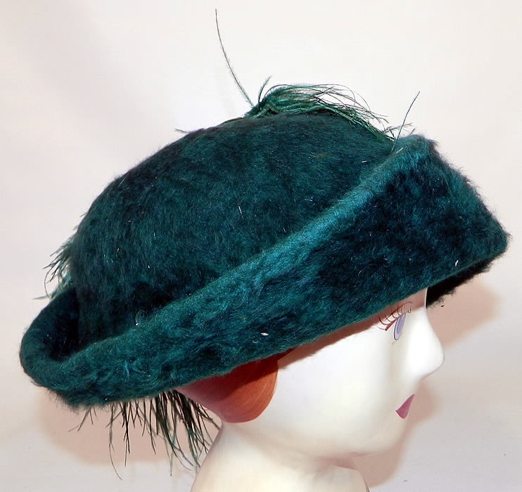 Edwardian Titanic Era Green Beaver Felt Fur Ostrich Feather Rolled Brim Hat. This unique ladies hat has an uneven upturned rolled brim, rounded top crown and is unlined. 