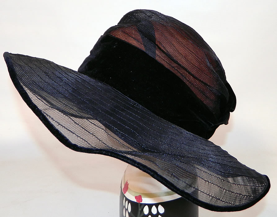 Vintage Gilman Importers Ritz Carlton New York Black Horse Hair Straw  Wide Brim Cloche Hat. There is black velvet trim edging the brim and a black silk velvet ribbon bow trim hatband. 