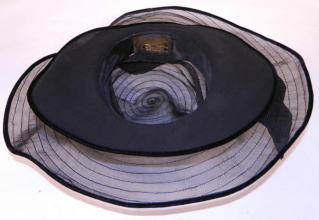 Vintage Gilman Importers Ritz Carlton New York Black Horse Hair Straw  Wide Brim Cloche Hat. The hat measures 22 inches inside crown circumference and 50 inches outside. It is in excellent condition and looks to have never been worn. This is truly a wonderful piece of quality made wearable textile millinery art!