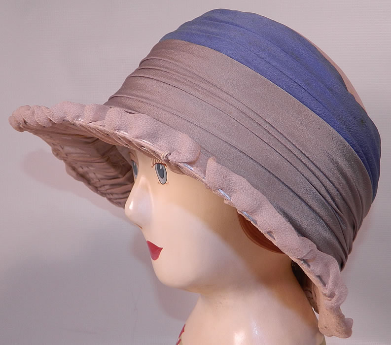 Vintage Maurice Importer Gray & Blue Silk Rose Flower Wide Brim Cloche Hat. This fabulous flapper cloche style  hat has a wired wide brim covered with a gray taupe sheer silk crepe pleated fabric and decorative stitching along the brim. 