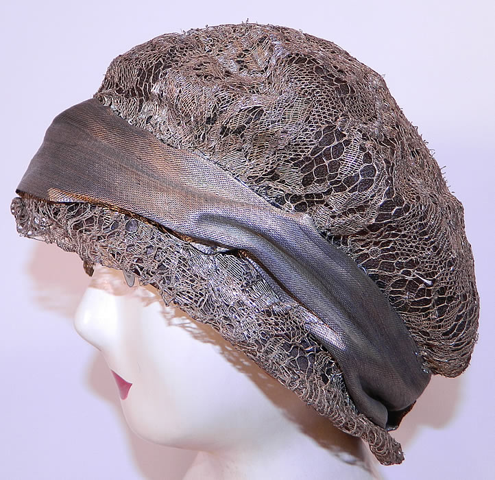 Vintage Art Deco Gold Lame Lamé Lace Flapper Cloche Hat. This vintage Art Deco gold lamé lace flapper cloche hat dates from the roaring 1920s.