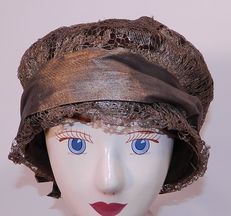 Vintage Art Deco Gold Lame Lamé Lace Flapper Cloche Hat. The hat is made of a wire frame covered with a sheer floral pattern gold metallic lamé lace. 