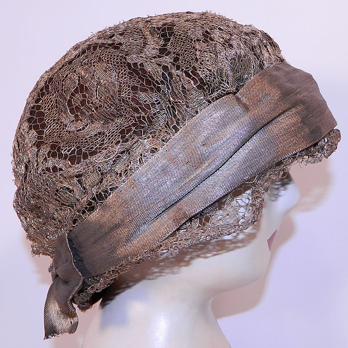 Vintage Art Deco Gold Lame Lamé Lace Flapper Cloche Hat. This fabulous flapper cloche style hat is form fitting, with a slight ruffled lace brim and gold lamé ribbon bow trim hatband.