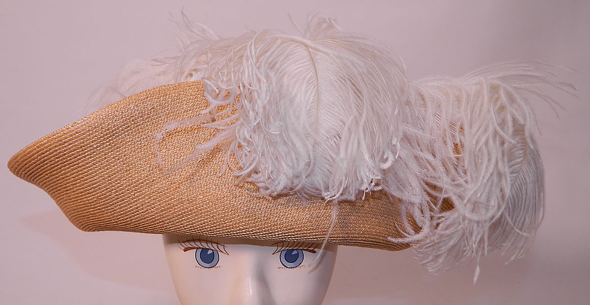 Edwardian Titanic Natural Straw Upturned Wide Brim White  Ostrich Feather Hat. This antique Titanic Edwardian era natural straw upturned wide brim white ostrich feather hat dates from 1912.