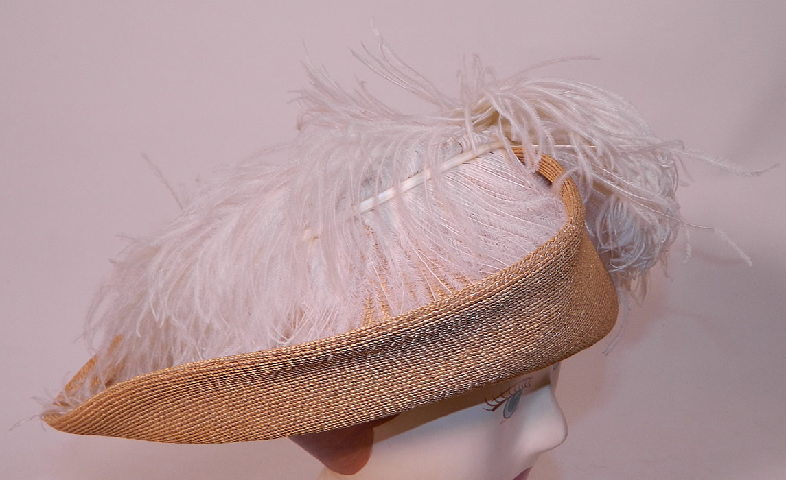 Edwardian Titanic Natural Straw Upturned Wide Brim White  Ostrich Feather Hat. This beautiful belle epoque grand summer hat has a wide upturned brim and would have sat atop a large full Gibson Girl style updo hairdo with hatpin. 