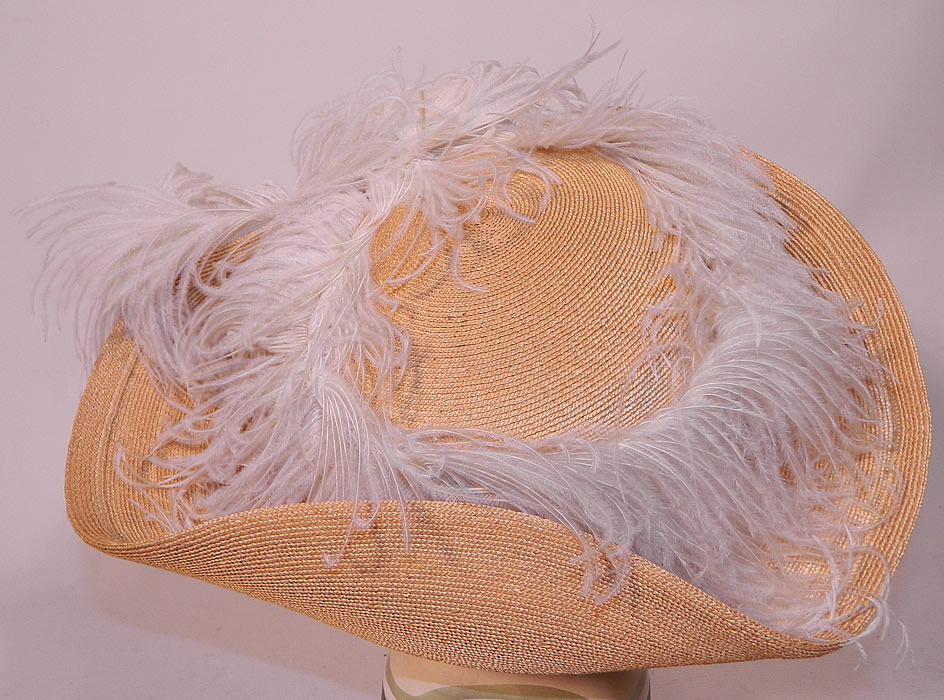 Edwardian Titanic Natural Straw Upturned Wide Brim White  Ostrich Feather Hat.  It is in excellent condition. This is truly a dramatic opulent ladies Titanic era hat and a wonderful piece of wearable millinery art!