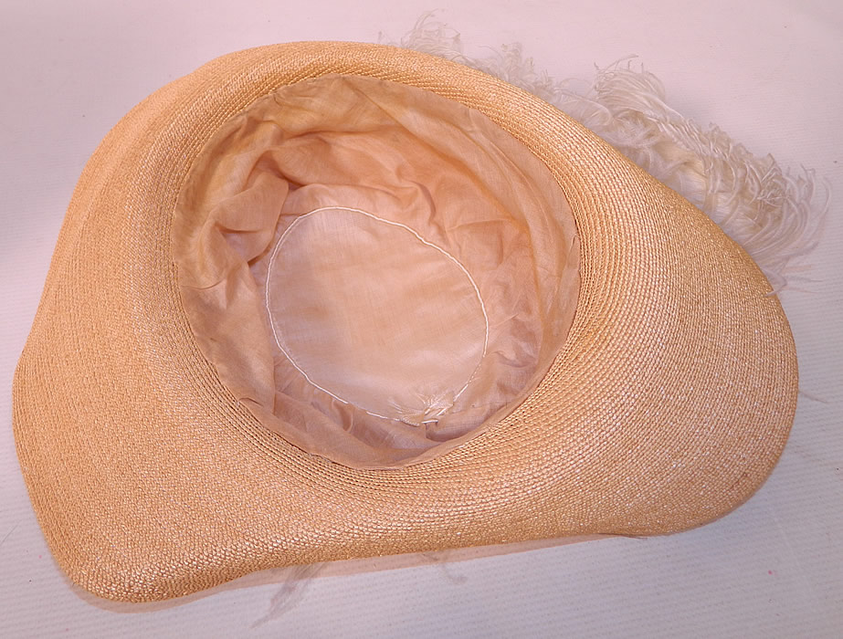 Edwardian Titanic Natural Straw Upturned Wide Brim White  Ostrich Feather Hat. It is fully lined inside the crown. The hat measures 23 inches inside crown circumference.