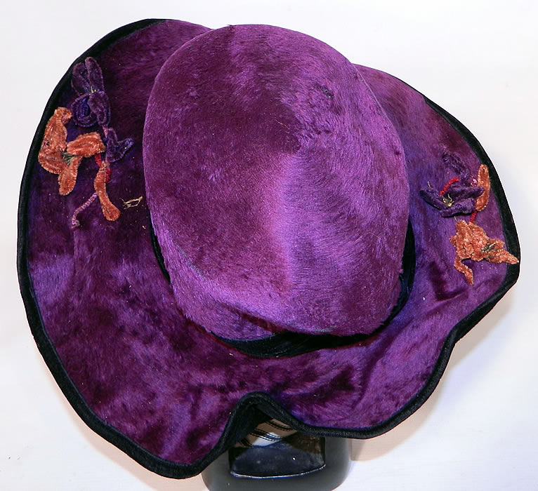 Edwardian Vintage Wolf Millinery Purple Velvet Flower Trim Wide Brim Hat. The hat is a large size measuring 23 inches inside crown circumference and 47 inches outside the brim. 