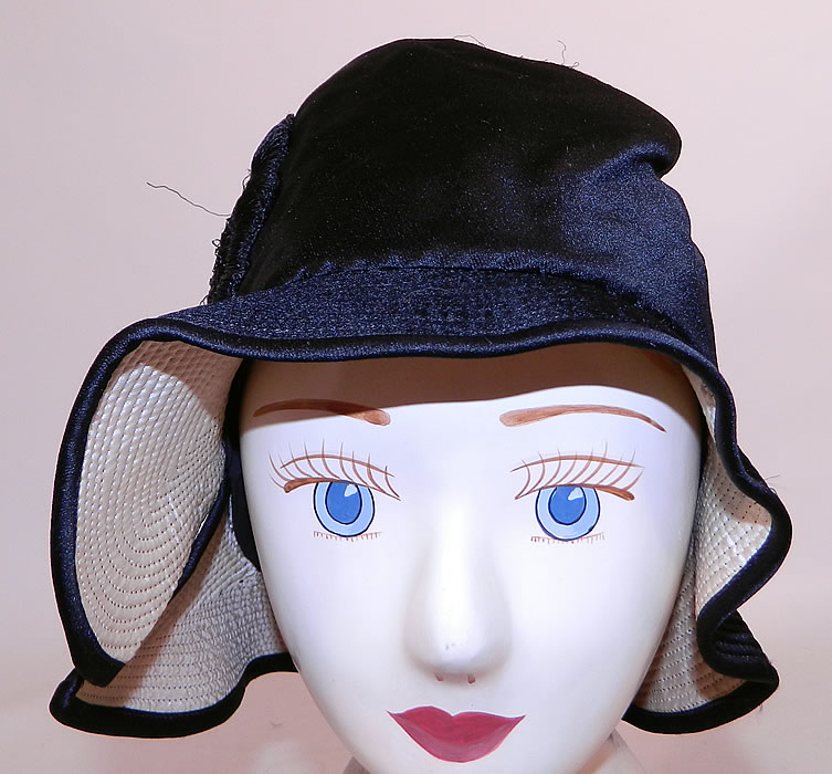 Vintage Marcelle Hats Art Deco Black  & White Silk Rosette Quilted Brim Flapper Cloche. The hat measures 22 inches inside crown circumference. 