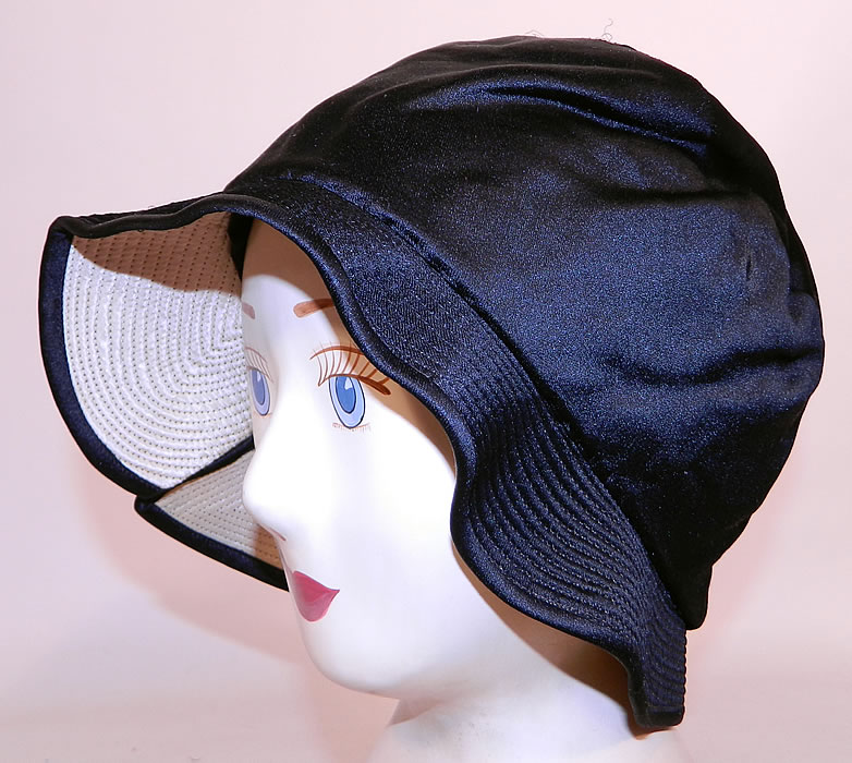 Vintage Marcelle Hats Art Deco Black  & White Silk Rosette Quilted Brim Flapper Cloche. This fabulous flapper cloche style hat has a form fitting style with an uneven wavy floppy brim. 