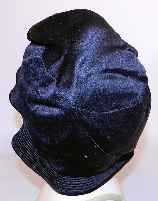 Vintage Marcelle Hats Art Deco Black  & White Silk Rosette Quilted Brim Flapper Cloche. It is in good condition, with three tiny pin holes on the bottom back (see close-up). 